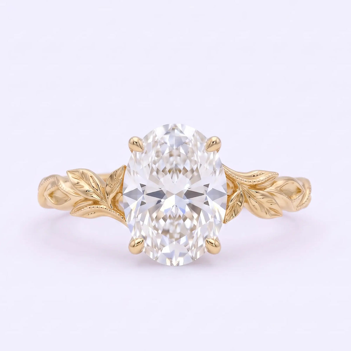 Oval moissanite solitaire leaf engagement ring in yellow gold