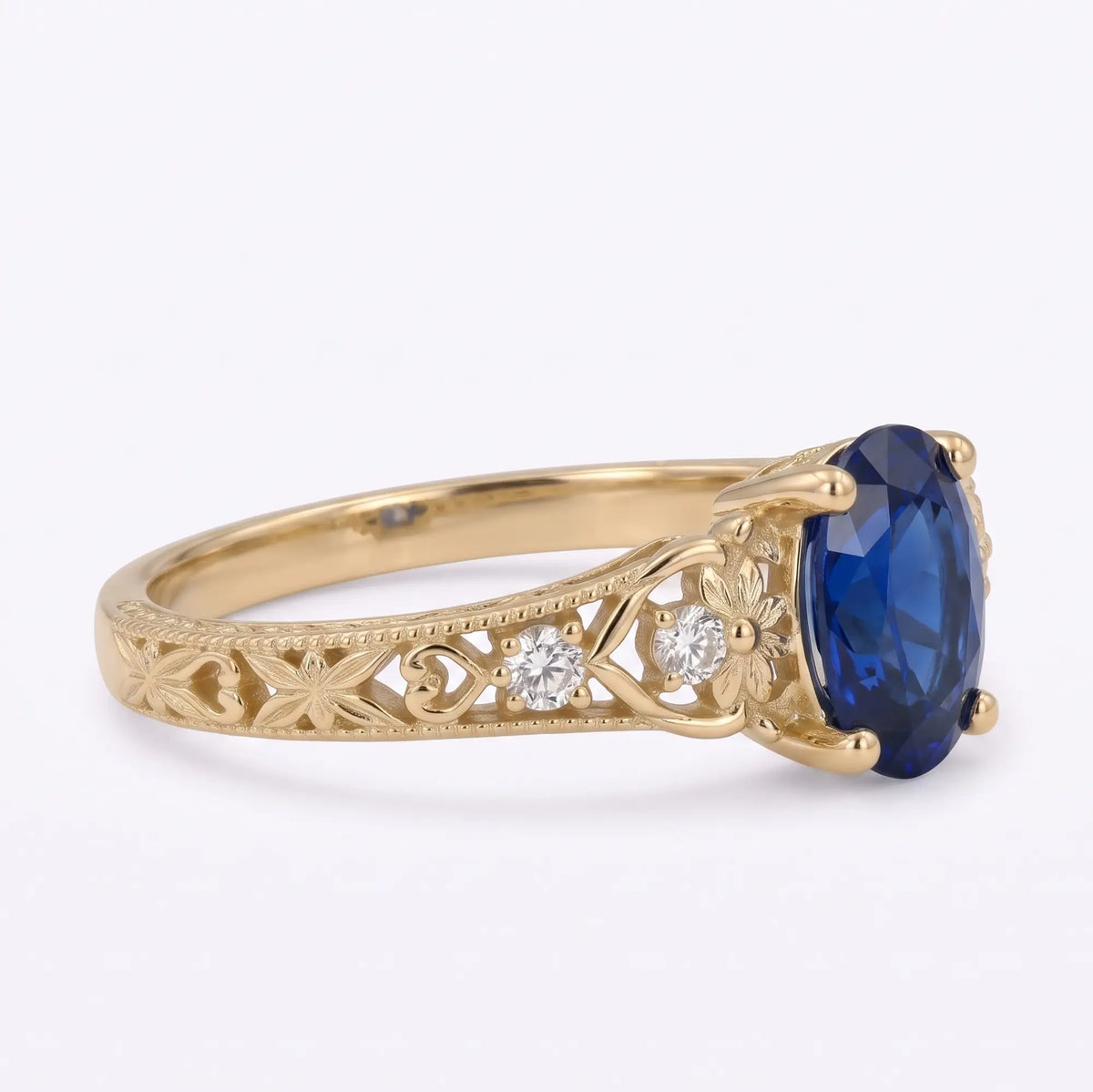 Nature inspired five stone engagement ring with oval blue lab sapphire
