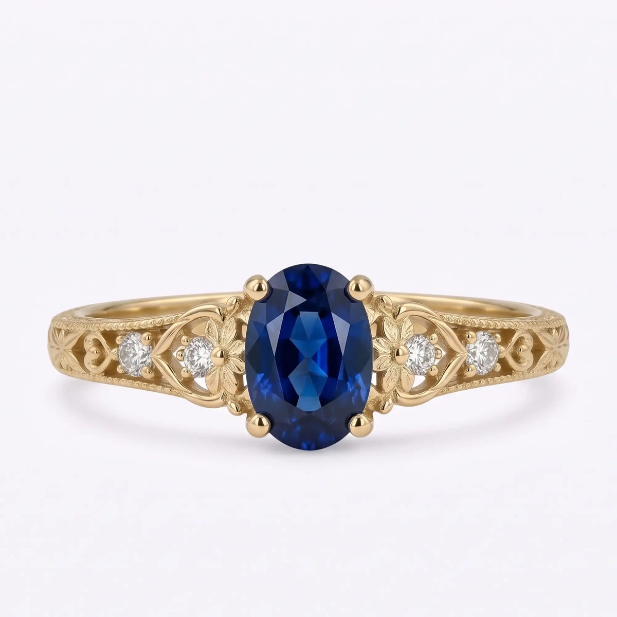 Vintage oval lab sapphire five stone engagement ring with floral gold details
