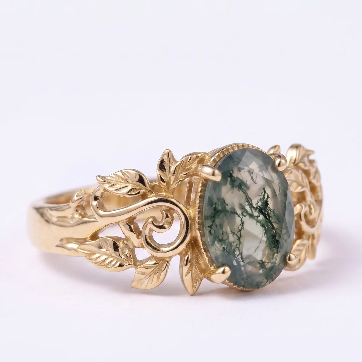 Close-up of leaf and vine band on moss agate solitaire ring
