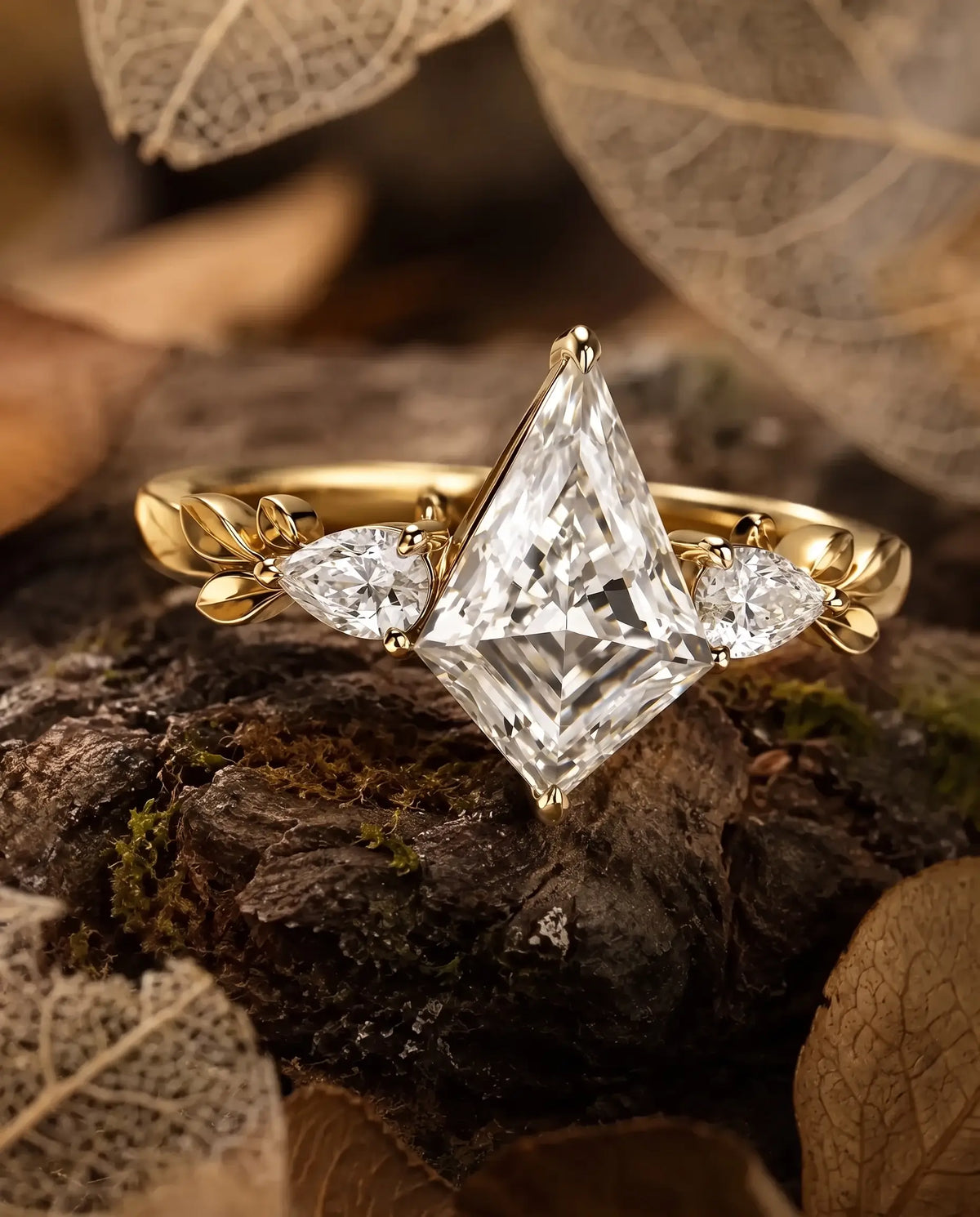 Two pear cut moissanite side stones measuring approximately 2 by 3 mm in a botanical three stone engagement ring