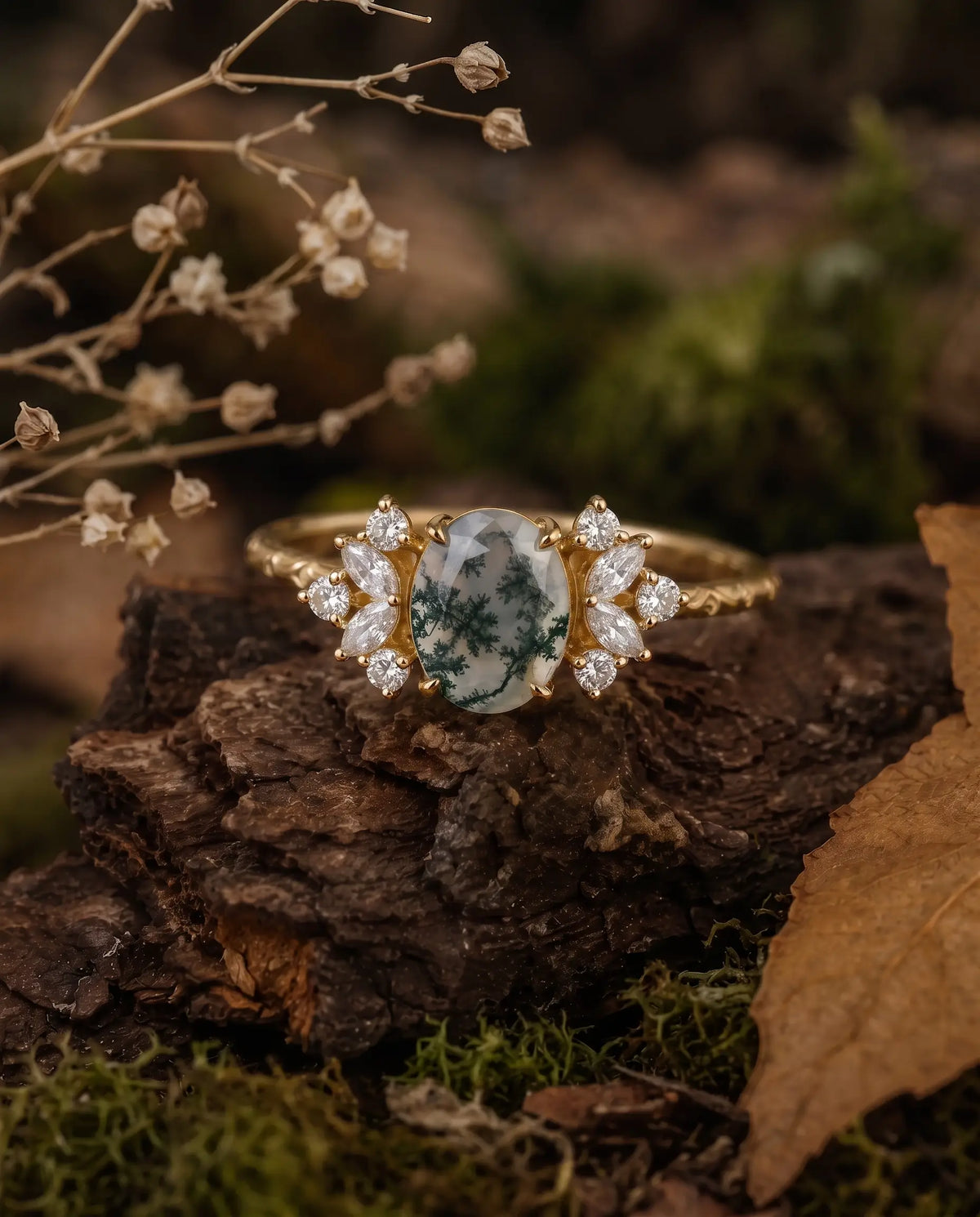 Cluster engagement ring with natural moss agate center stone and hand-finished engraved shank