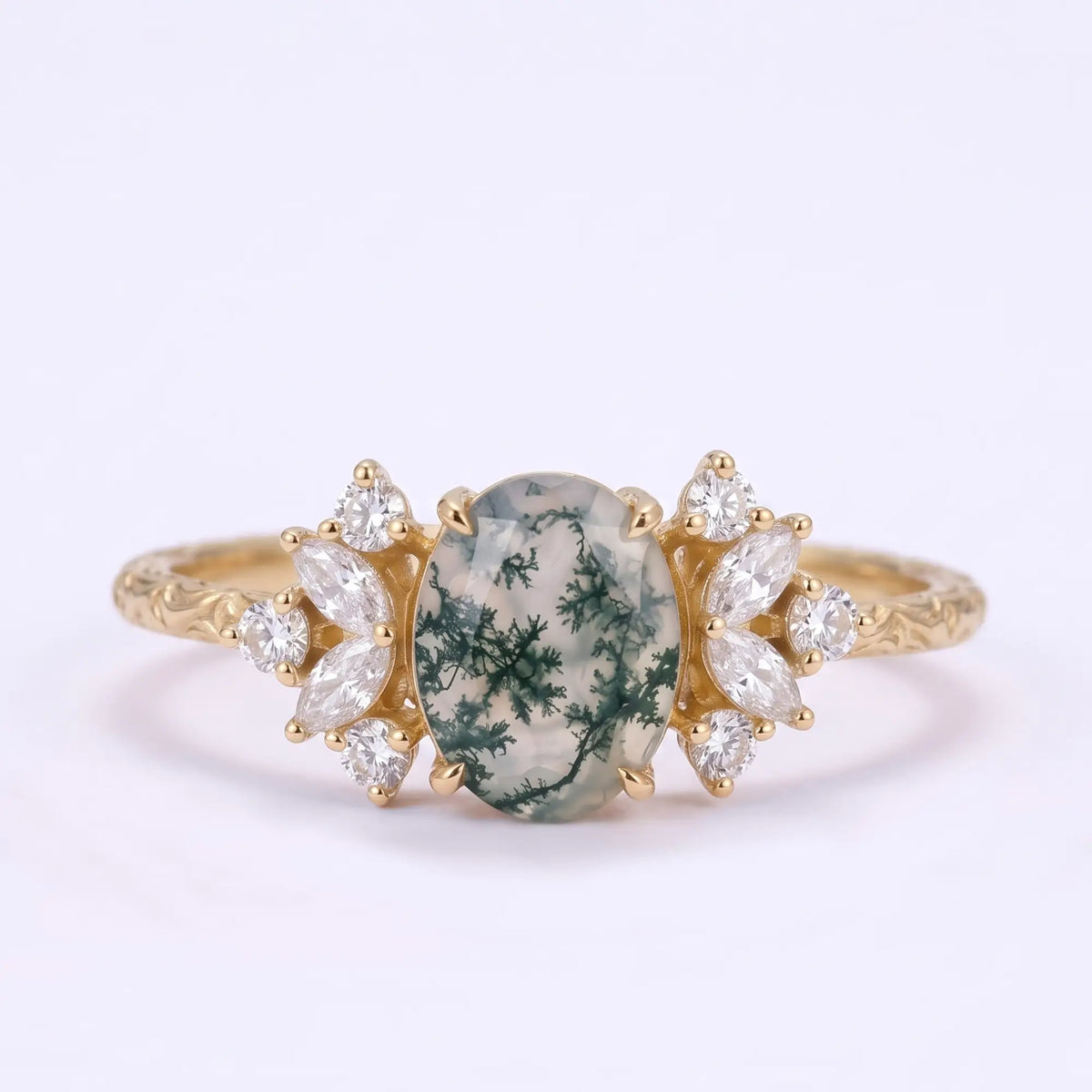 Oval moss agate cluster engagement ring with marquise and round moissanite accents in yellow gold
