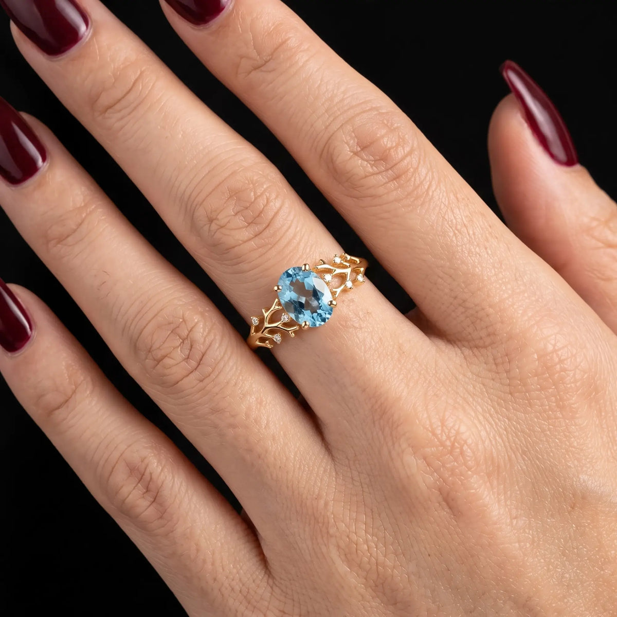 November birthstone London Blue Topaz engagement ring worn on hand