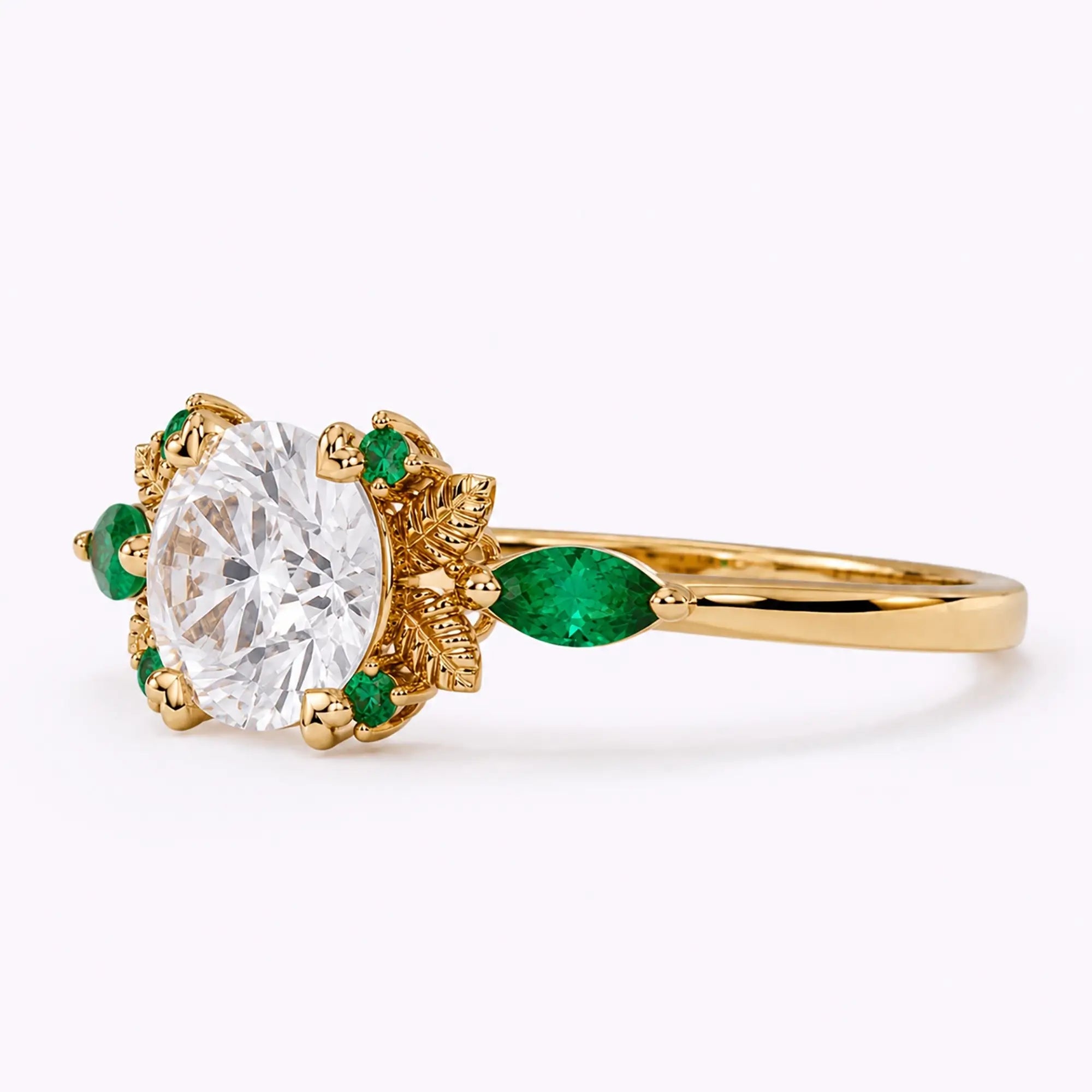 Left view of nature-inspired moissanite leaf ring with emerald side stones