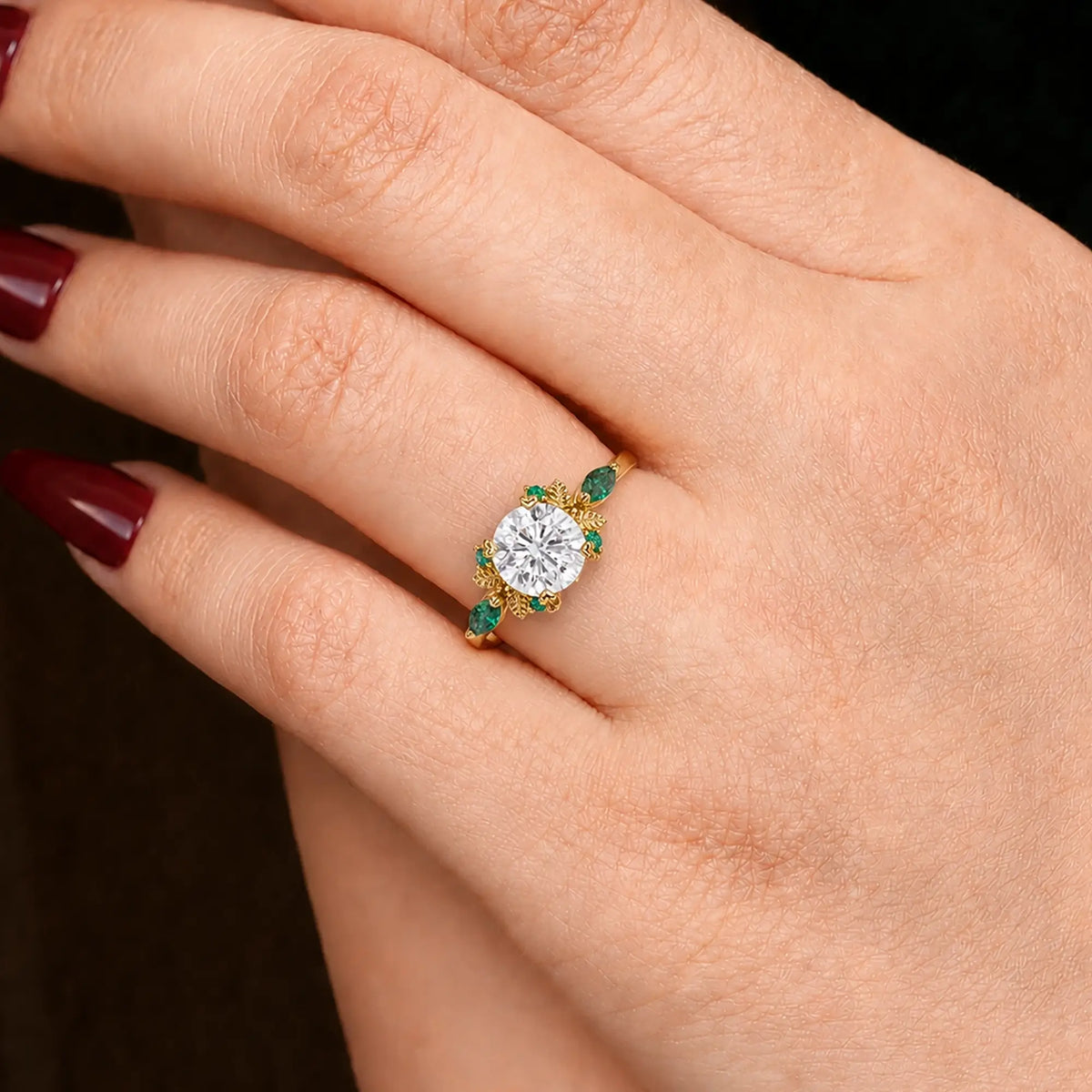 Round cut moissanite leaf engagement ring worn on hand