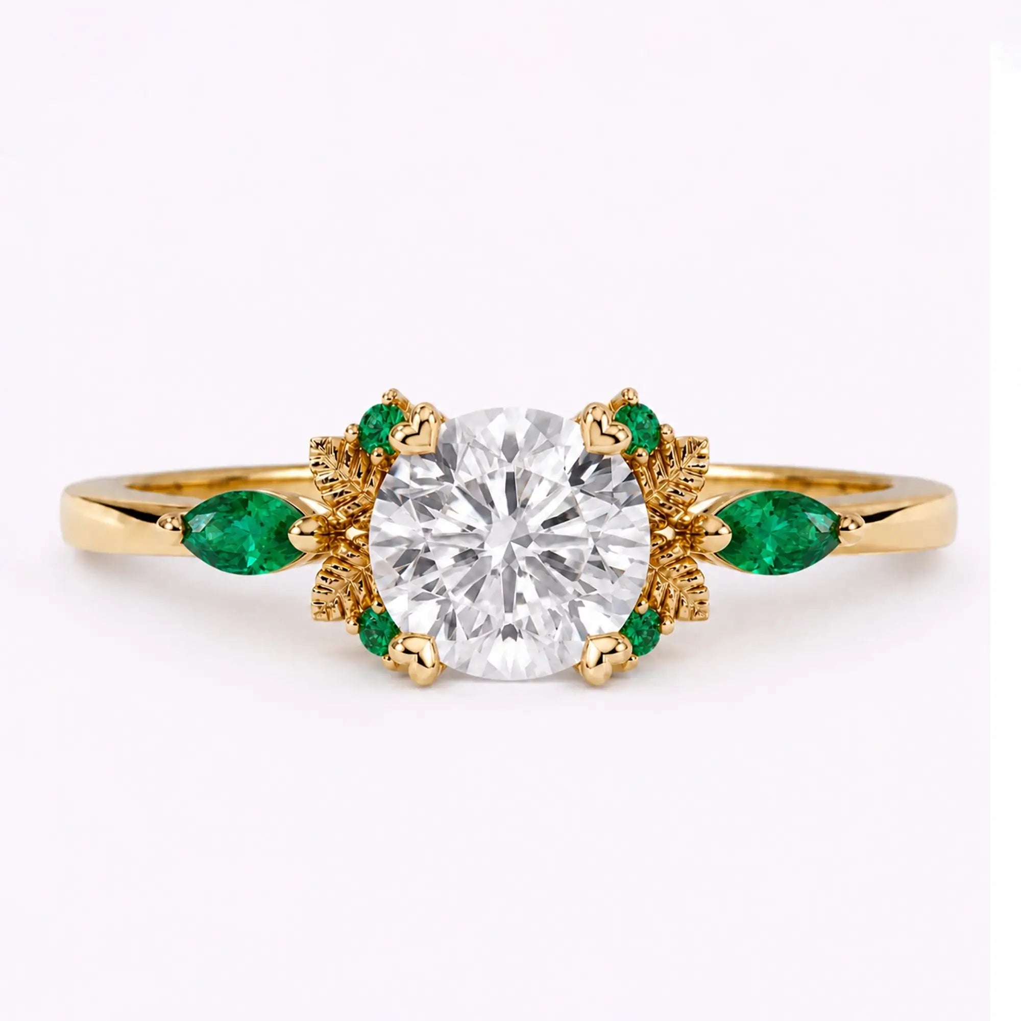 Round cut moissanite leaf engagement ring with emerald accents in yellow gold