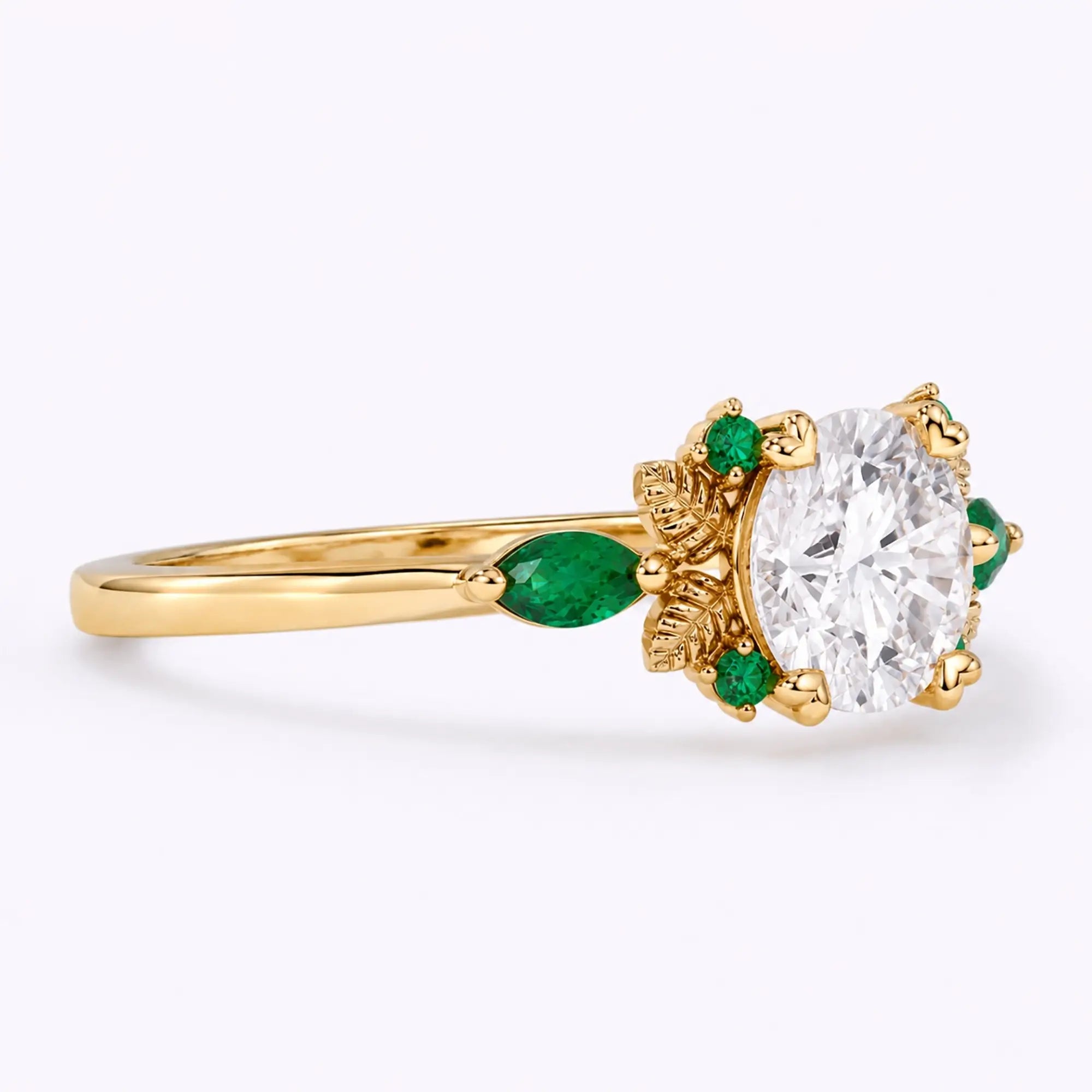 Side view of round moissanite engagement ring showing the slim gold band and leaf details