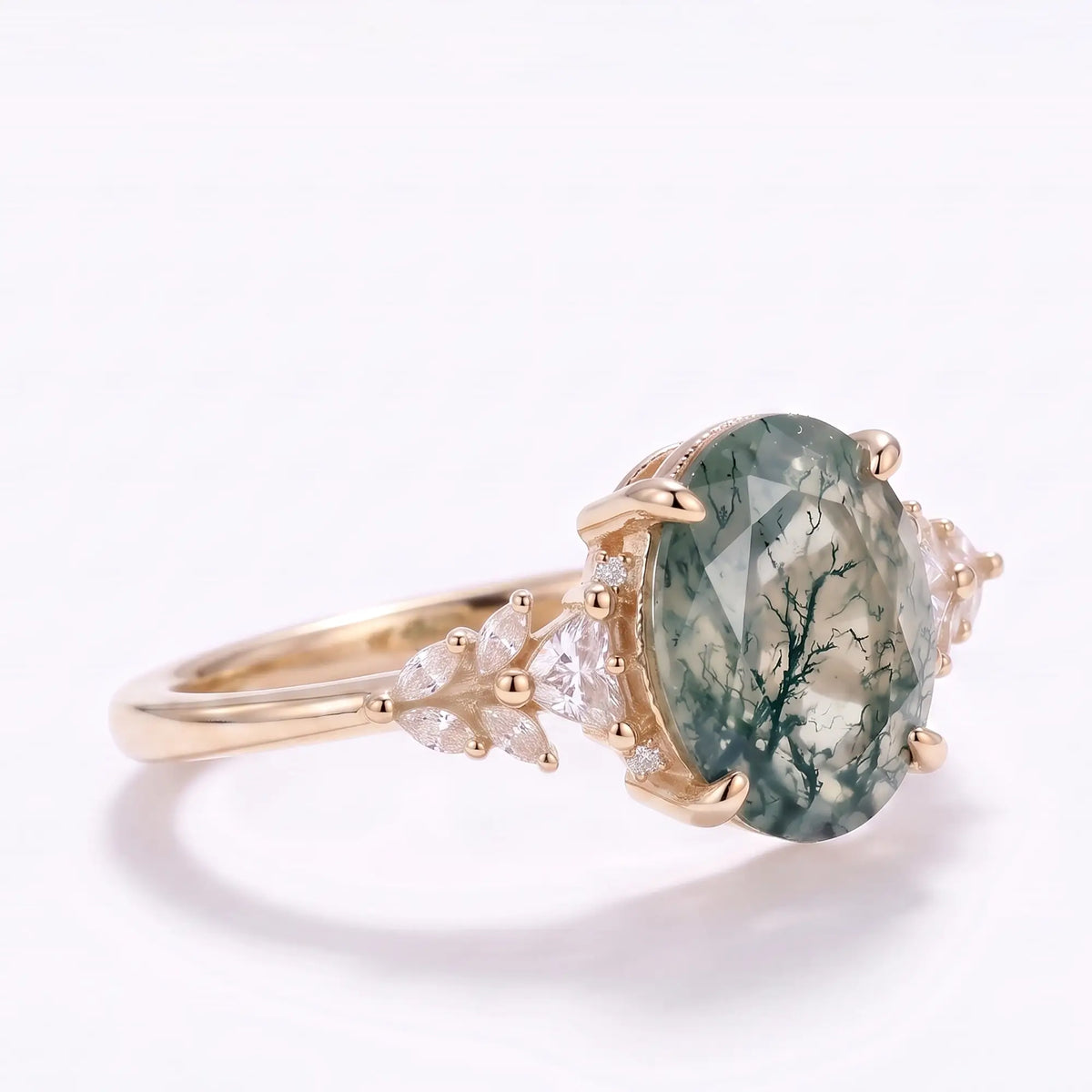 Side profile of oval moss agate engagement ring with slim solid gold band