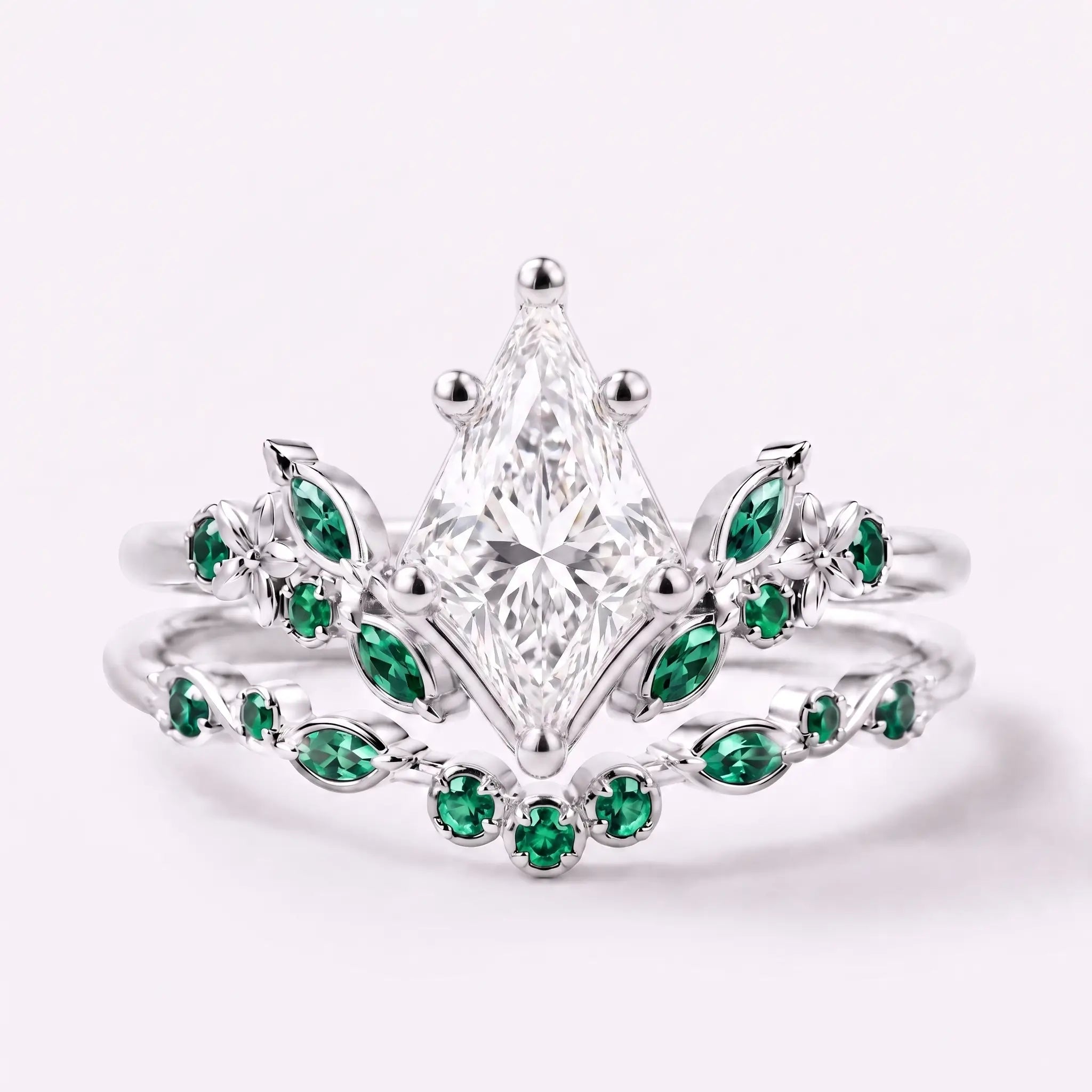 Kite cut moissanite floral bridal ring set with emerald cluster accents in white gold