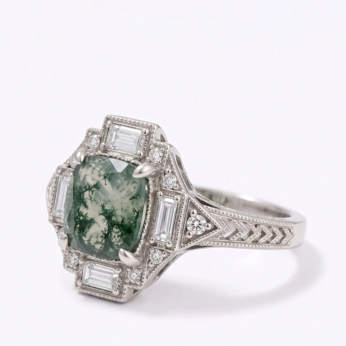 Three quarter view of Art Deco cushion cut moss agate ring with baguette moissanite accents