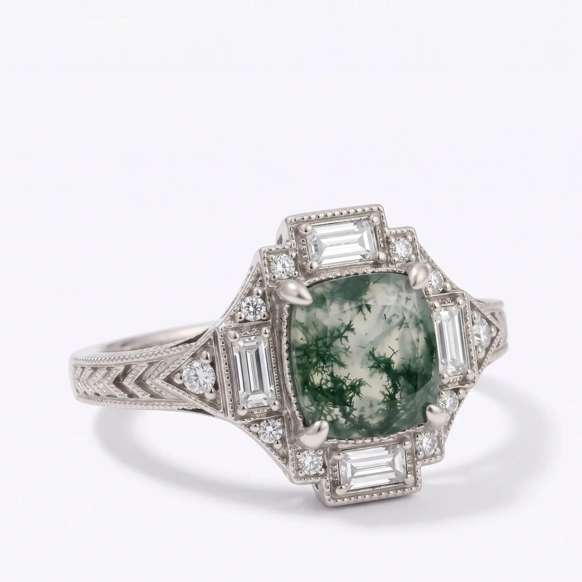 Side view of vintage moss agate halo ring with geometric white gold shoulders
