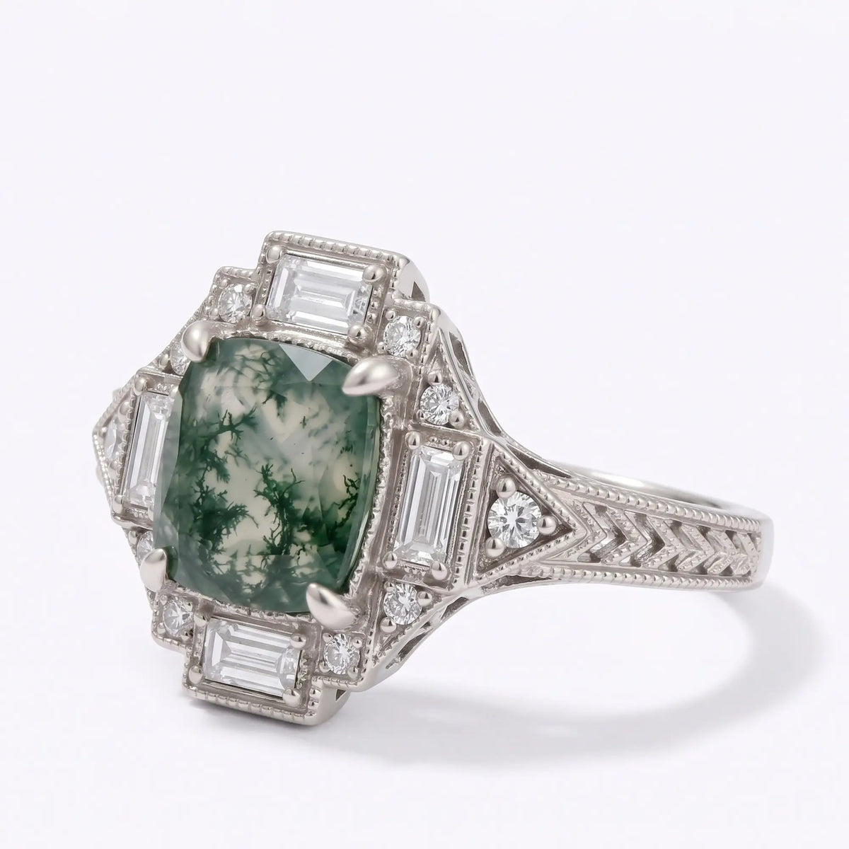 Front view of vintage cushion moss agate halo engagement ring with geometric Art Deco design