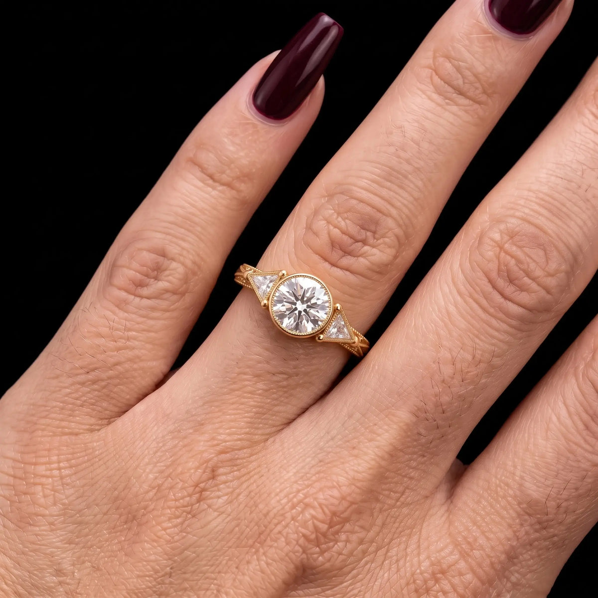 Round moissanite botanical three-stone engagement ring shown in available gold options