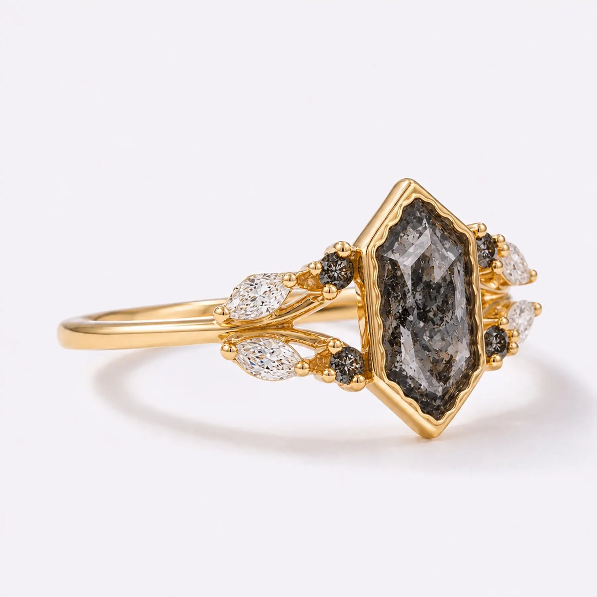 Side view of elongated hexagon bezel ring showing gold band and layered setting