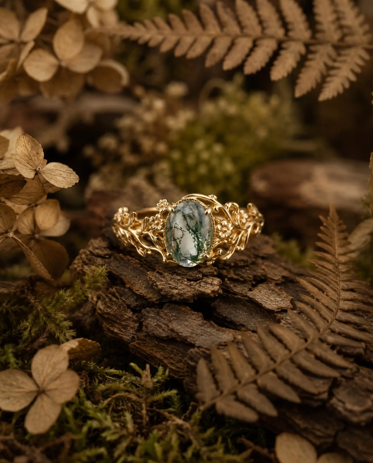 Nature inspired moss agate botanical ring styled in an elegant jewelry scene