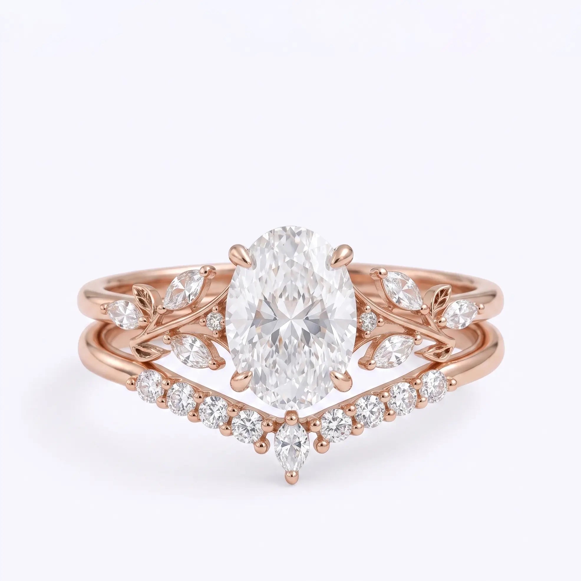 Oval cut moissanite leaf bridal ring set in rose gold with curved wedding band