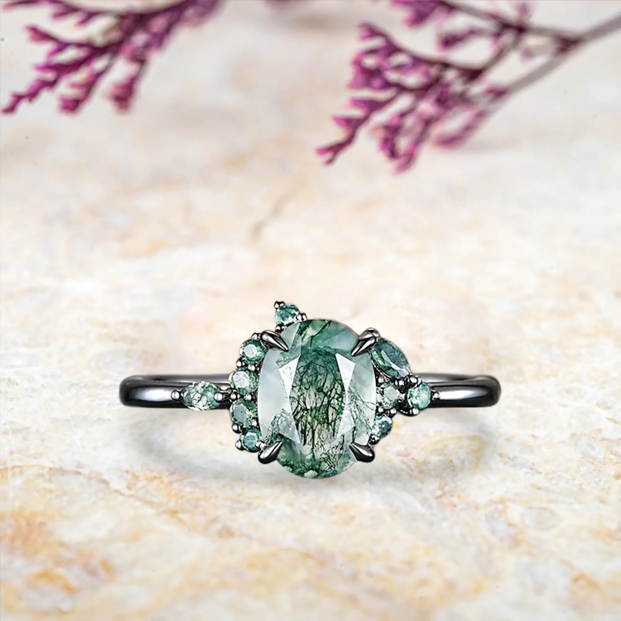 Oval moss agate Gothic engagement ring black gold with eagle claw prongs and cluster design