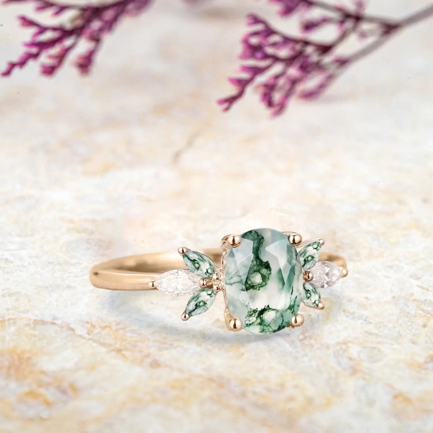 Side view of moss agate cluster ring showing rose gold band and marquise stone details