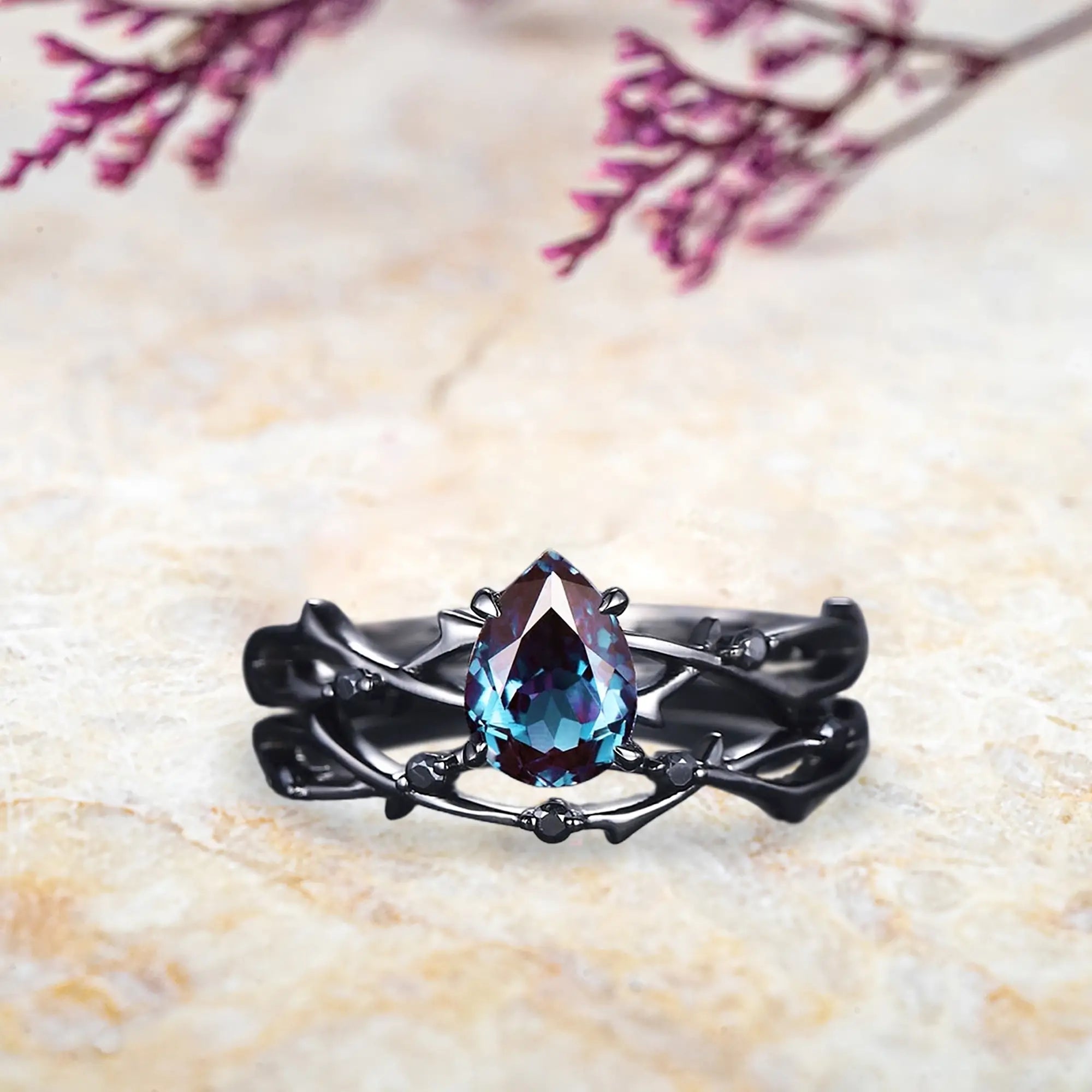 Pear alexandrite bridal set in black gold with twig branch design and black onyx accents