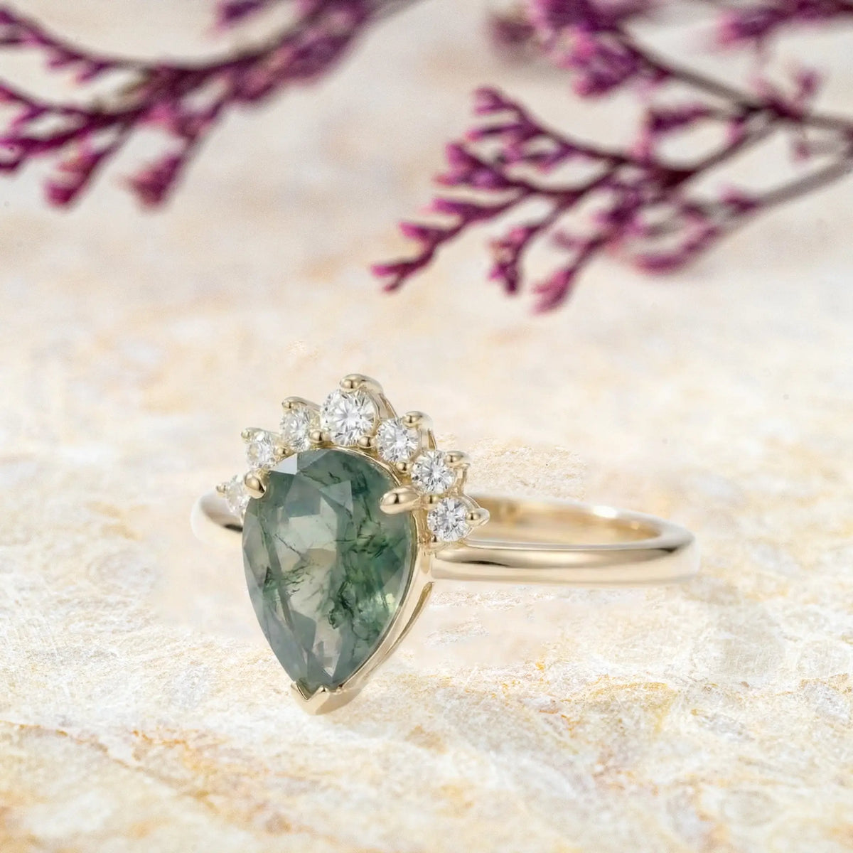 Side view of moss agate half-halo ring showing yellow gold band and crown details