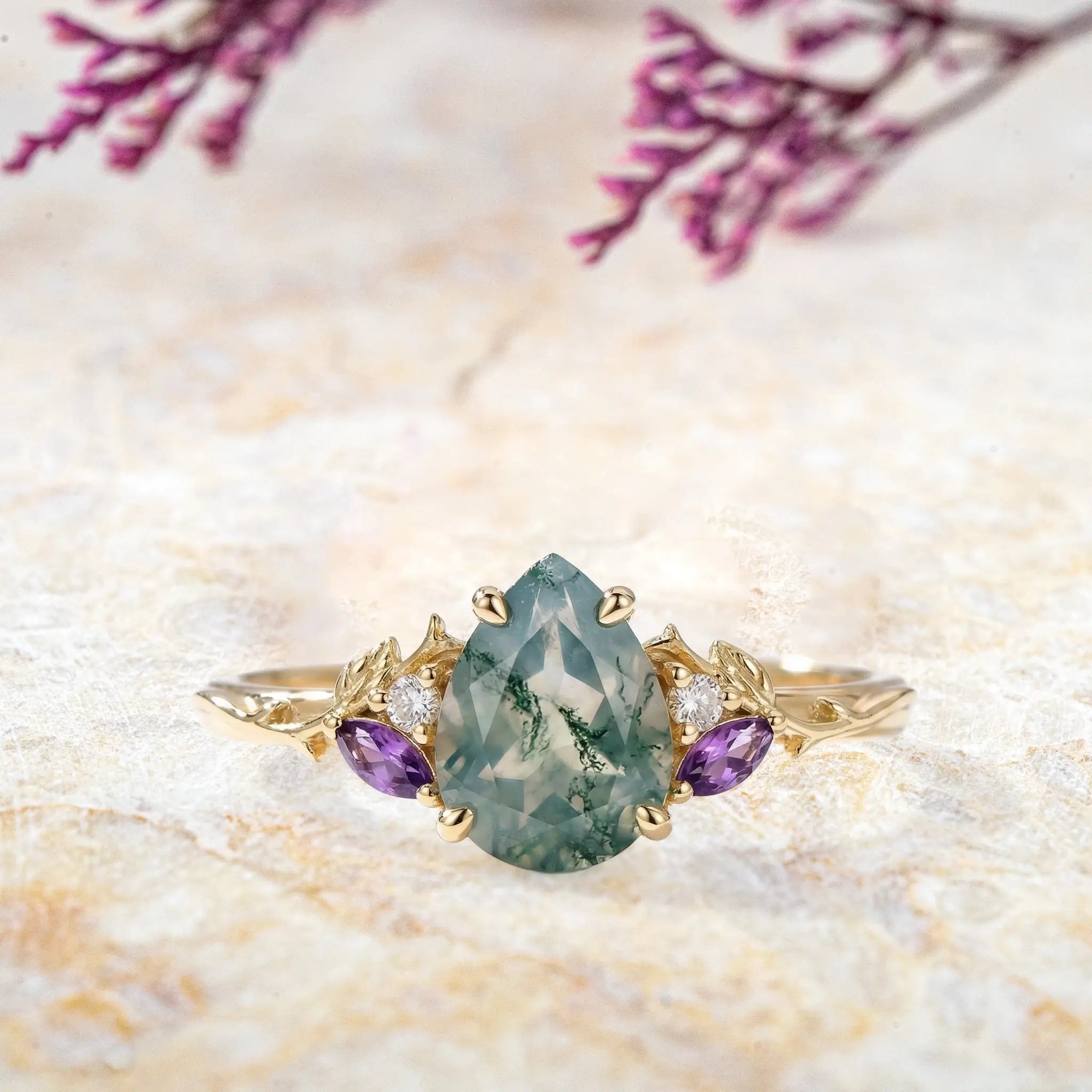 Pear cut moss agate engagement ring with leaf design in solid gold
