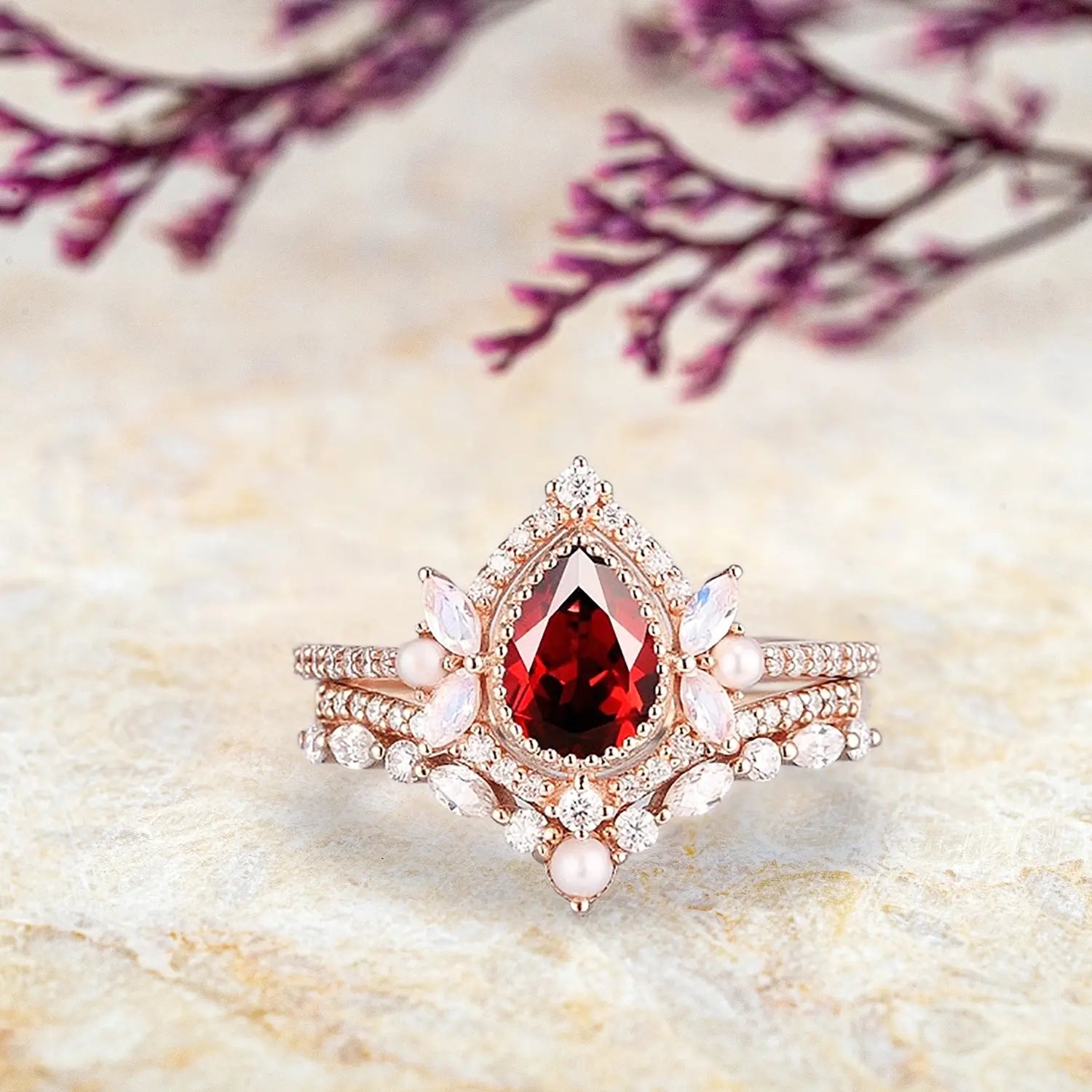 Pear ruby engagement ring with pearl moonstone moissanite cluster halo and curved wedding band set