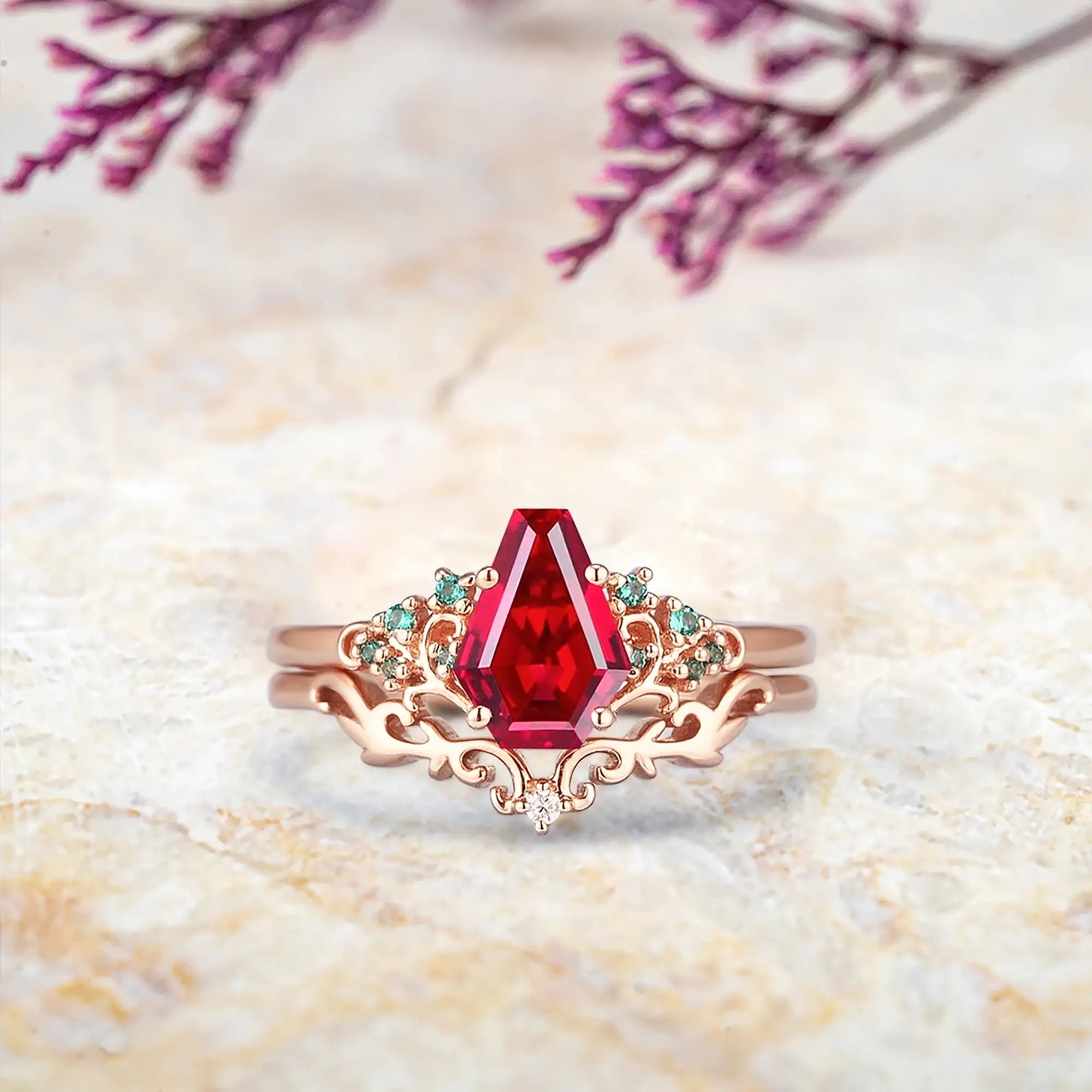 Coral-inspired ruby coffin engagement ring set in rose gold with emerald clusters
