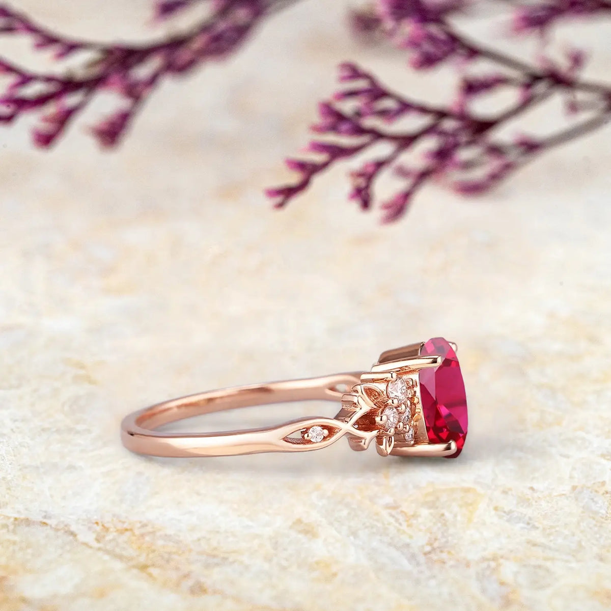 Oval lab ruby engagement ring in 14k gold with moissanite side stones