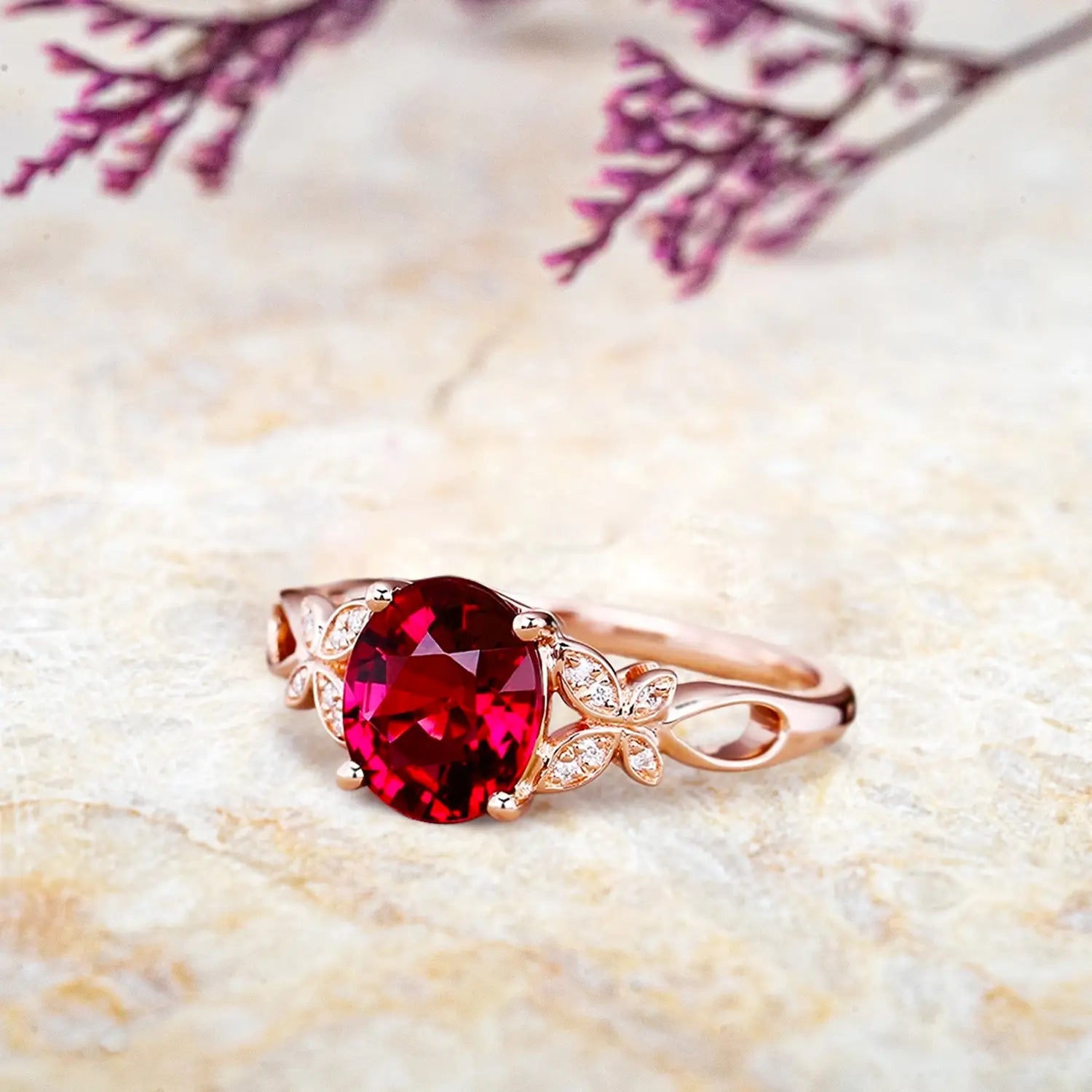 Side view of oval ruby ring showing butterfly wing details and nature inspired floral band profile