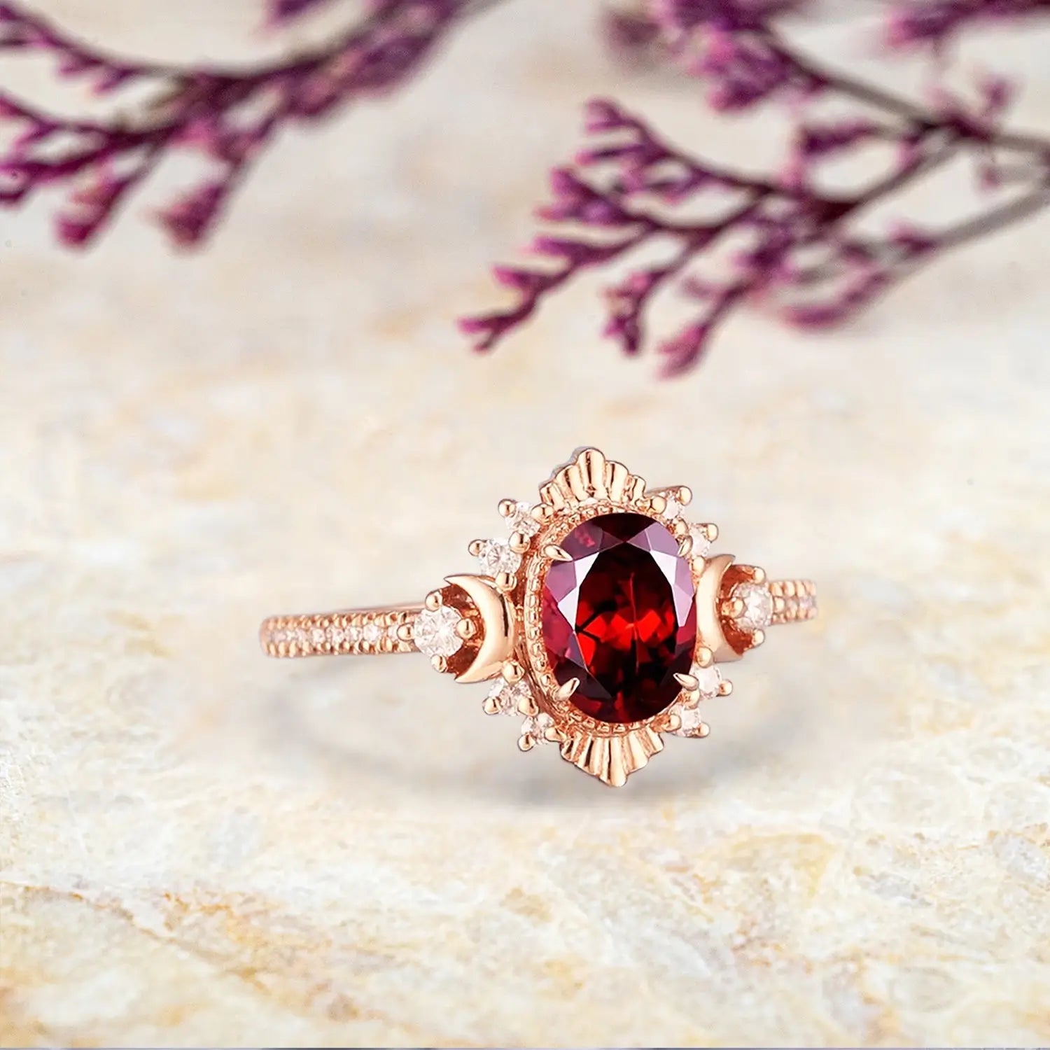 Oval garnet ring with vintage moon design and solid gold band