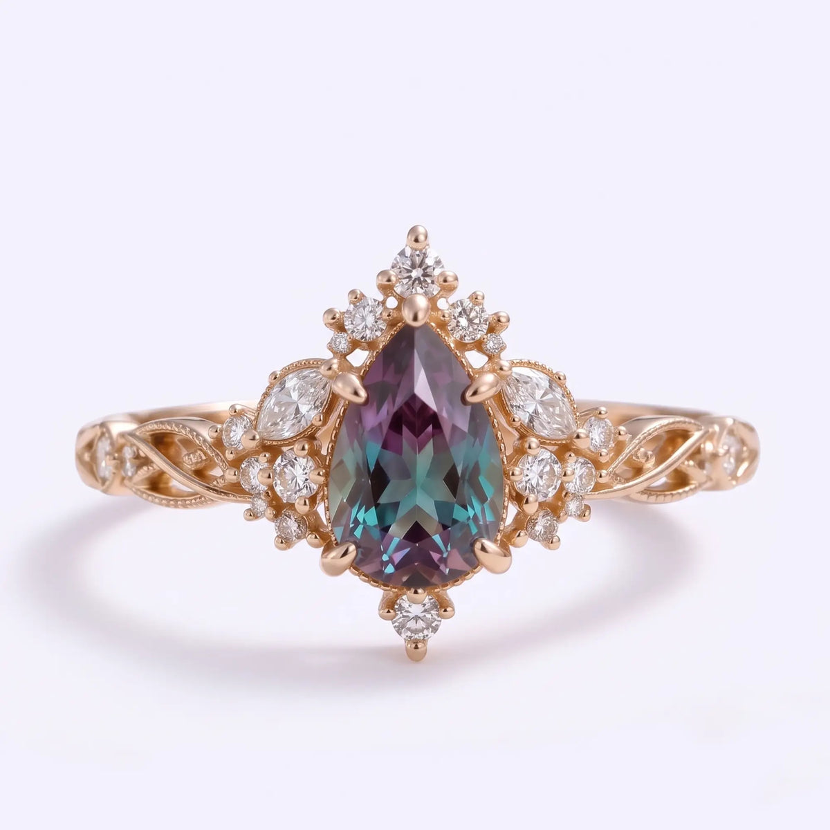 Front view of Selviora vintage Edwardian pear cut lab alexandrite engagement ring featuring a teal-purple gemstone, cluster halo and twisted rose gold openwork band.