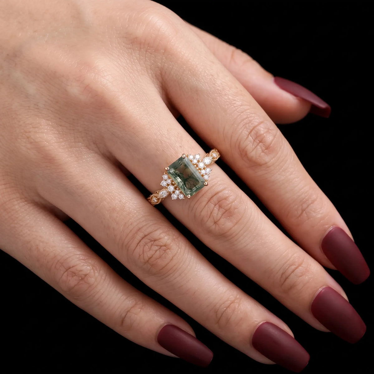 Verdelisse vintage moss agate cluster engagement ring worn on hand, showing its elegant proportions and heirloom-inspired gold design.