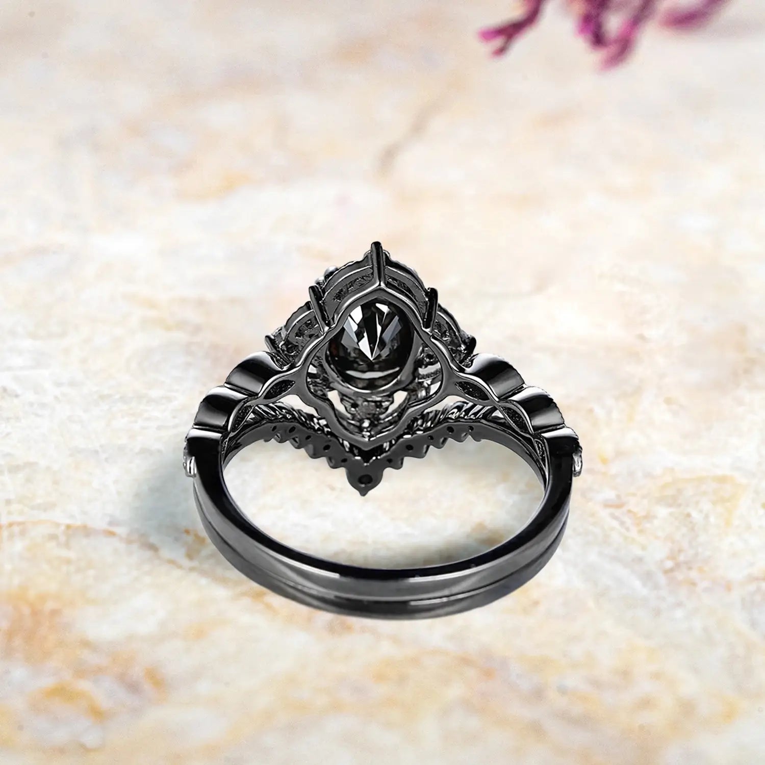 Back view of Gothic black onyx engagement ring set showing vintage crown cluster and chevron wedding band craftsmanship