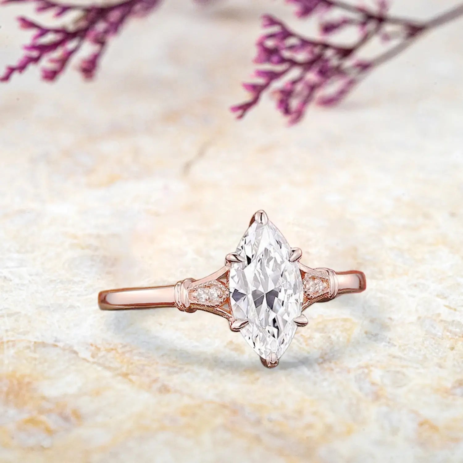 marquise moissanite center stone with pear shaped moissanite accents in split shank setting Three-stone