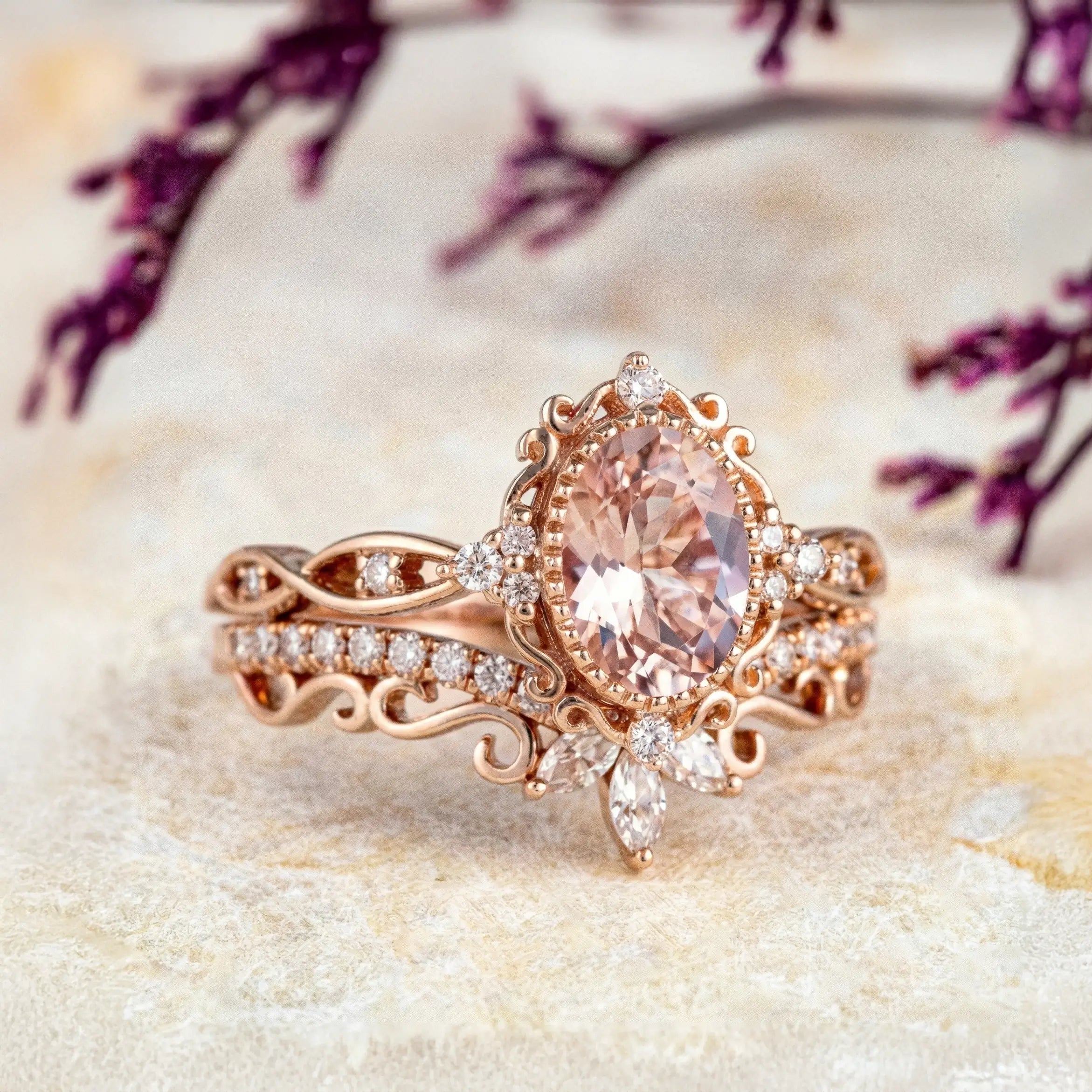 Oval pink morganite engagement ring with vintage crown cluster and curved marquise diamond wedding band set
